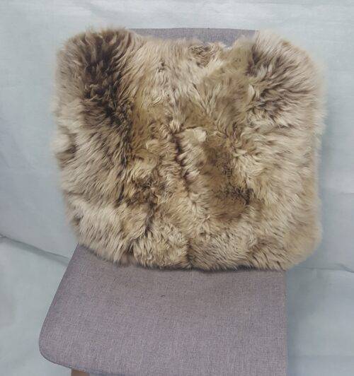 Cappuccino longwool sheepskin cushion on chair