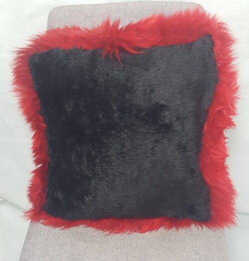 Rear of Red longwool cushion with black rear